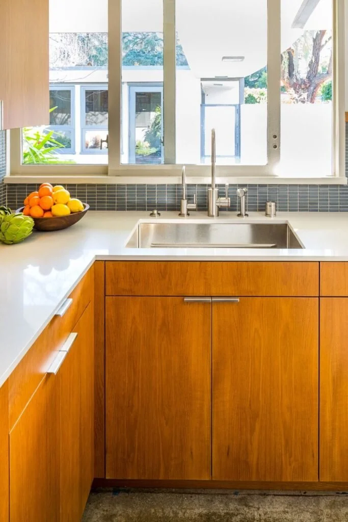 Teak was a very popular wood in the middle of the century.  Mark Cutler Design used teak in this kitchen remodel.